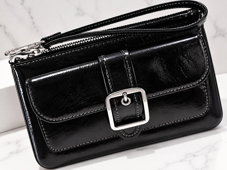 Hermosa cartera de mano para dama negra con correa y broche plateado