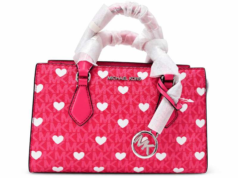 bolso de mano rosa con corazones blancos mk